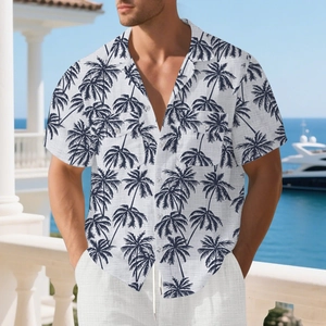 Close-up of palm tree print texture and chest pocket on men's linen resort shirt