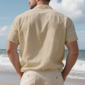 Detailed back view of men's linen short sleeve shirt showing the box pleat and texture
