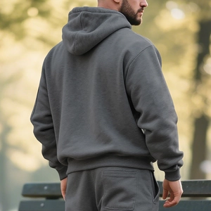 Detail view of the back of a men's heavy cotton dark grey fleece hoodie and jogger set