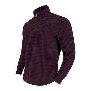 Detailed view of dark burgundy waffle knit texture on men's half-zip sweatshirt