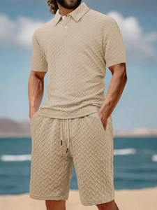 Close-up of beige men's polo set showing intricate herringbone textured knit fabric