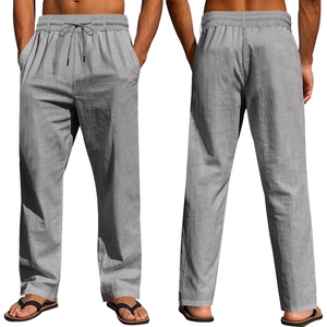 Detail view of men's casual linen trousers with drawstring waist and textured fabric