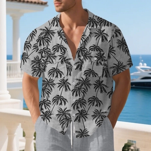 Detail of grey short sleeve shirt with black palm tree prints and front chest pockets