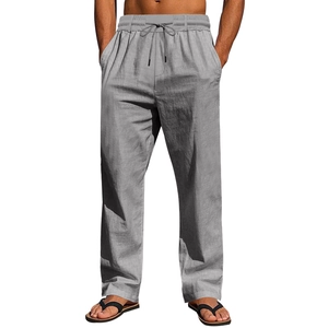 Detailed texture of grey linen beach trousers with drawstring elastic waistband