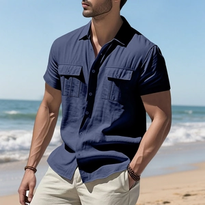 Close-up of navy blue linen shirt showing double chest pockets and breathable fabric texture
