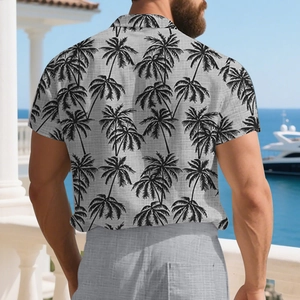 Detail of grey short sleeve shirt featuring tropical palm tree print and linen texture