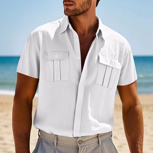 Close-up of white linen shirt showing breathable fabric texture and flap chest pockets
