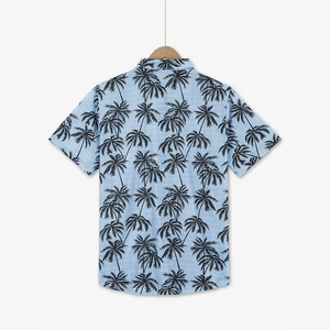 Detailed back view of a light blue Hawaiian shirt featuring black coconut tree prints