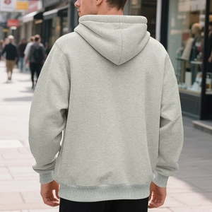 Back view of a men's light grey hooded sweatshirt with ribbed cuffs in urban setting