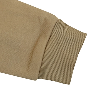 Close-up of khaki fleece hoodie sleeve featuring ribbed elastic cuff and knit texture