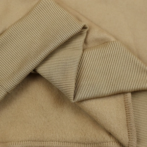 Detail view of khaki fleece lining and ribbed knit cuff of a winter hoodie
