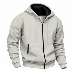 Detail of light grey waterproof hoodie featuring black zipper pockets and ribbed cuffs