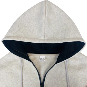 Detail of hoodie neckline with size M tag and 95% polyester 5% elastane fabric texture