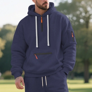 Detail of dark blue fleece hoodie with orange zippers and white drawstring cords