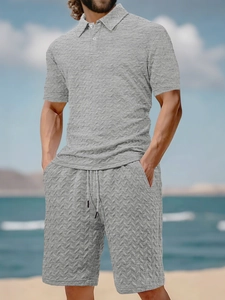 Close-up of the light gray polo and shorts set featuring unique textured waffle weave fabric