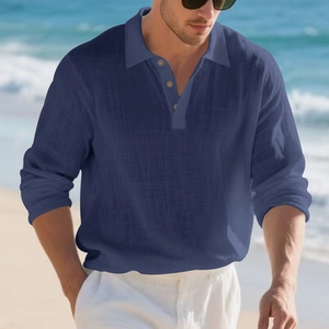 Detail of navy linen polo shirt featuring breathable texture and wooden buttons