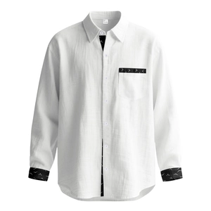 Close-up of linen fabric texture with black wave pattern detail on collar and pocket