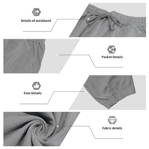 Detail view of grey linen trousers featuring drawstring waist and elastic cuffs