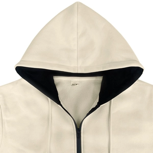 Detail of hoodie neckline with Size M label, contrast hood lining and premium zipper