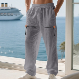 Detail showing grey linen joggers with elastic drawstring waist and orange zipper pocket