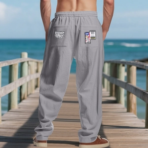 Rear view of men's casual grey linen trousers with elastic waist and unique back pocket print