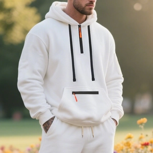 Detail of men's fleece hoodie set with half-zip orange puller and matching pants