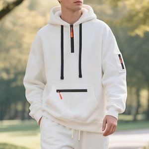 Detail of men's fleece hoodie with half-zip collar, orange pullers, and tactical pockets