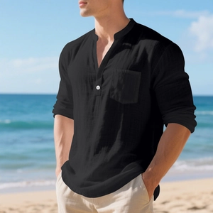 Detail of black linen-style Henley shirt featuring single chest pocket and white button