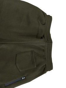 Detail view of olive green jogger pants featuring elastic waistband and side zipper pocket