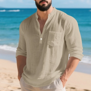 Detail of breathable beige linen shirt featuring a grandad collar and front chest pocket
