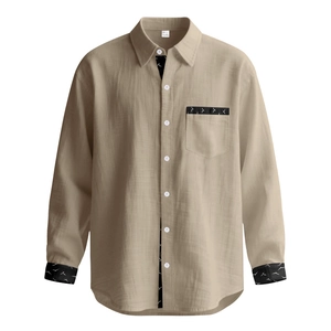 Detail of khaki linen-texture shirt featuring black bird print accents on cuffs and pocket