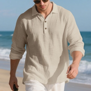 Detail of beige linen long sleeve polo shirt with three-button placket on beach background