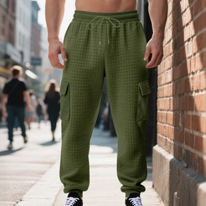 Detail of olive green cargo joggers with quilted waffle texture and adjustable drawstring
