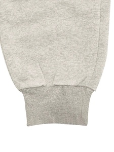 Close-up of gray fleece hoodie ribbed cuffs with premium stitching details on fabric