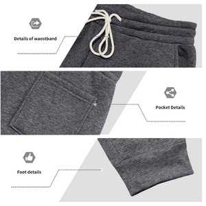 Detail view of charcoal gray joggers featuring elastic drawstring waist and ribbed cuffs