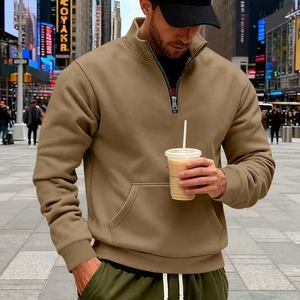 Men's quarter-zip khaki sweatshirt with kangaroo pocket and ribbed cuffs in a street setting