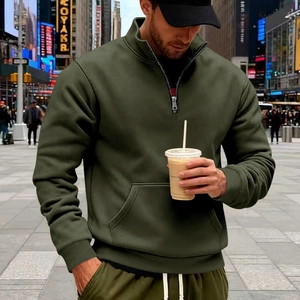 Detail of dark olive green men's half-zip tracksuit with high collar and kangaroo pocket
