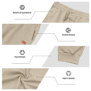 Detail view of khaki joggers featuring waffle texture, drawstring waist and side pockets