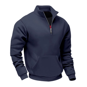 Detail view of navy blue half-zip fleece sweatshirt with ribbed cuffs and kangaroo pocket