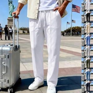 Detail of drawstring waist and vertical seam on white men's straight casual trousers