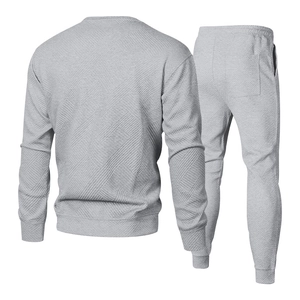 Detail of grey men's tracksuit set featuring unique embossed diamond twill texture on the back