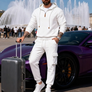 Detail of white half-zip hoodie and cargo pants set with leather zipper pull detail