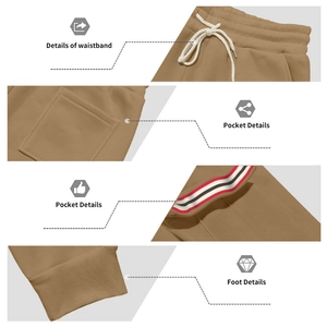 Détail de la taille à cordon et des poches avec garniture rayée sur le pantalon jogging