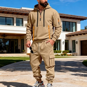 Detail of khaki men's techwear tracksuit showing sleeve pocket and adjustable strap