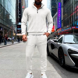 Detail of white waffle knit tracksuit showing vertical texture and half-zip collar