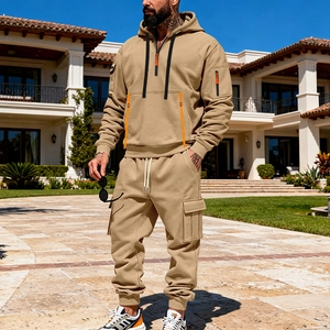 Detail of khaki men's hoodie set featuring half-zip pocket and cargo jogger pants
