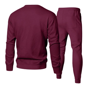 Back view of burgundy men's tracksuit set featuring 3D geometric embossed texture