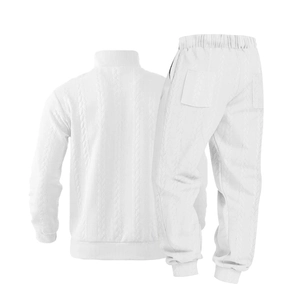 Rear view of white cable-knit tracksuit showing ribbing detail and elastic waistband