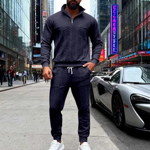 Detailed texture of navy blue striped men's casual tracksuit with half-zip sweatshirt