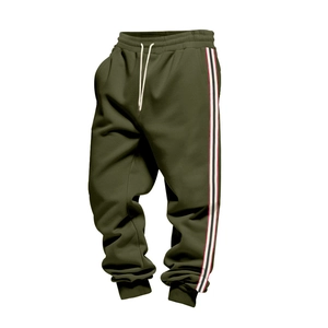 Detail of olive green joggers showing side stripes, drawstring waist and ribbed cuffs